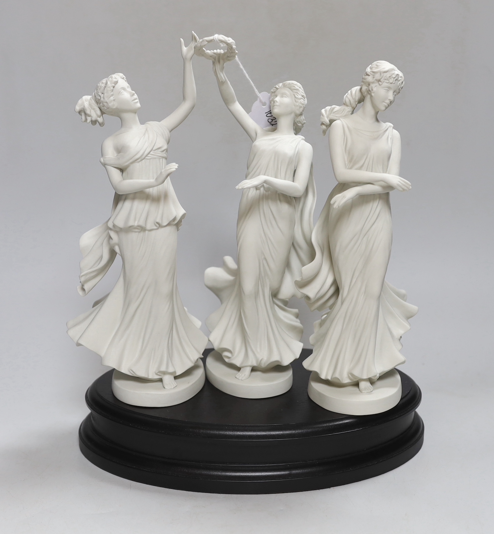 Wedgwood for Compton and Woodhouse, the three graces, raised on an oval stand, each numbered 365 to the base, 29cm high